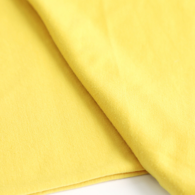 O algodão fez malha a única tela 100gsm do jérsei para a camisa ensaca o alinhamento
