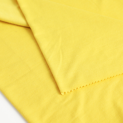 O algodão fez malha a única tela 100gsm do jérsei para a camisa ensaca o alinhamento